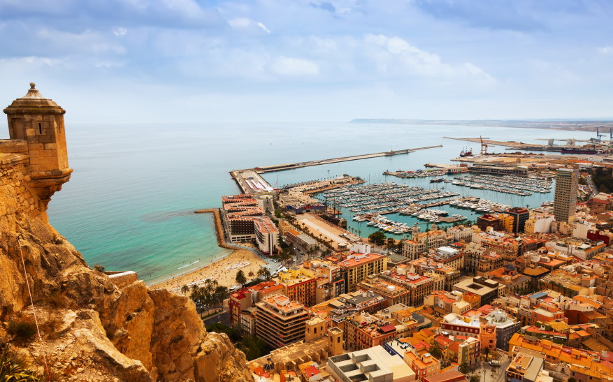 Top view of Port  in Alicante with docked yachts from castle. Spain