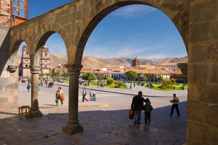 Cusco, Peru - September 9, 2015: People and tourists walking in the streets of Cusco, former Inca capital, famous travel destination in Peru and one of the most visited historical cities in the world.