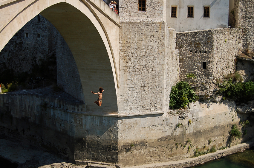 Mostar, Bosnia Herzegovina - September 10, 2009: Bridge jumping activity from Mostar bridge rebuilt after the Balkans war