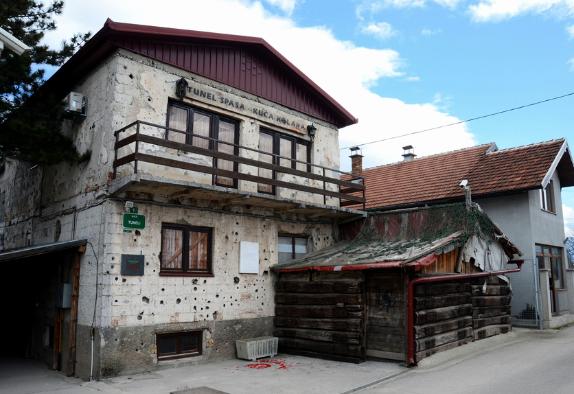 Sarajevo, Bosnia-Hercegovina - March 24, 2015: The house alongside the Sarajevo airport through which the Sarajevo Tunnel connected Bosnia's largest city with other parts of Bosnia during the Siege of Sarajevo. The almost one kilometer long tunnel was constructed in 1993 during the Yugoslav civil war between Bosnians, Croats and Serbs. Note the bullet holes and other marks of warfare on the walls.