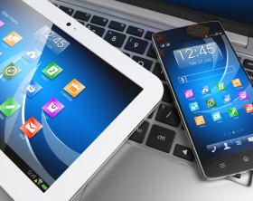 Mobile devices. Tablet PC, smartphone on laptop, technology concept. 3D