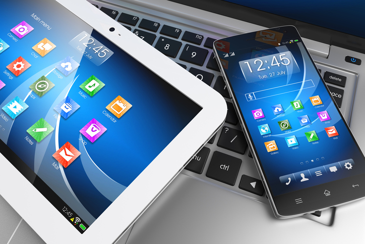Mobile devices. Tablet PC, smartphone on laptop, technology concept. 3D