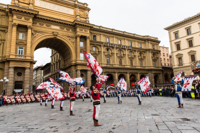 Florence, Italy - April 4, 2015:  We happened to be in Florence for Scoppio del Carro "Exploding of the Cart".  Here performers in traditional garb participate in a flag throwing performance before the arrival of the cart.