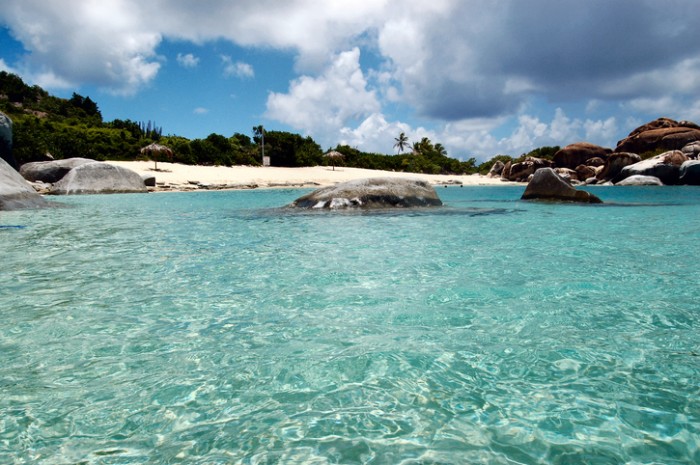 Boulders, turquoise waters and sandy beach