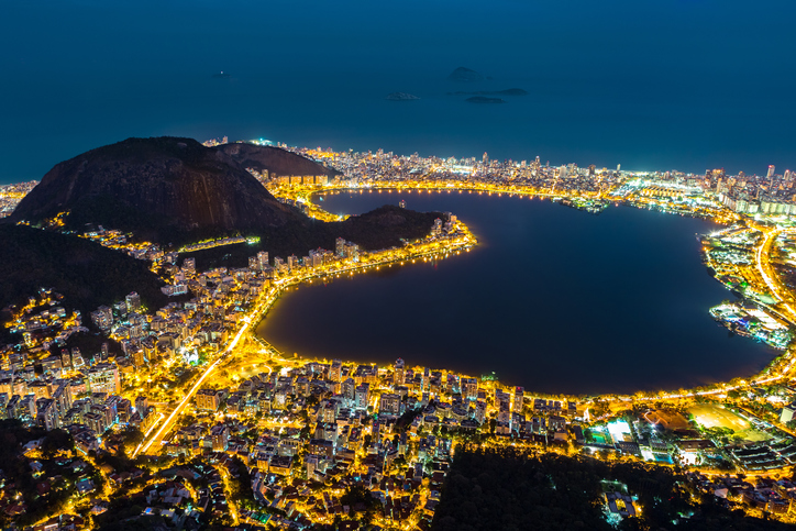 Aerial view of Rio de Janeiro, by night. Copacabana, Ipanema, Leblon and Lagoa neighborhoods border Rodrigo de Freitas lagoon