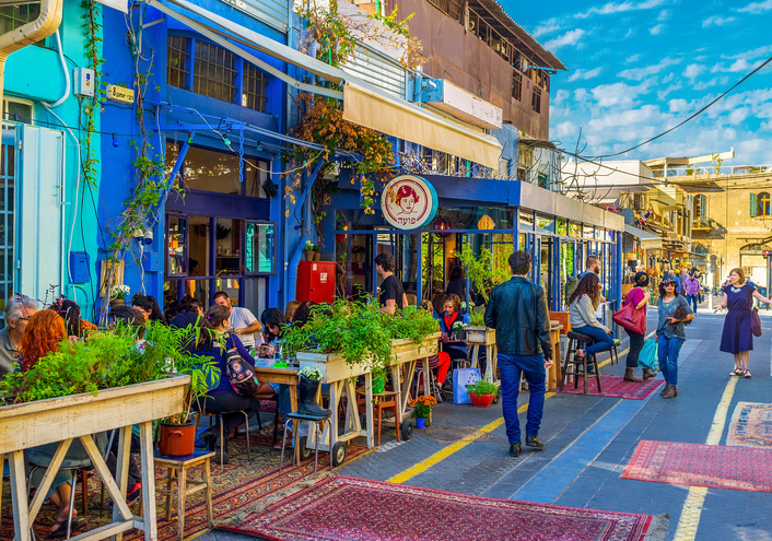 Tel Aviv, Israel - February 25, 2016: The flea market neighborhood of old Jaffa is full of the cozy cafes, decorated with plants in pots, colorful rugs and wooden details, its a very popular place among tourists