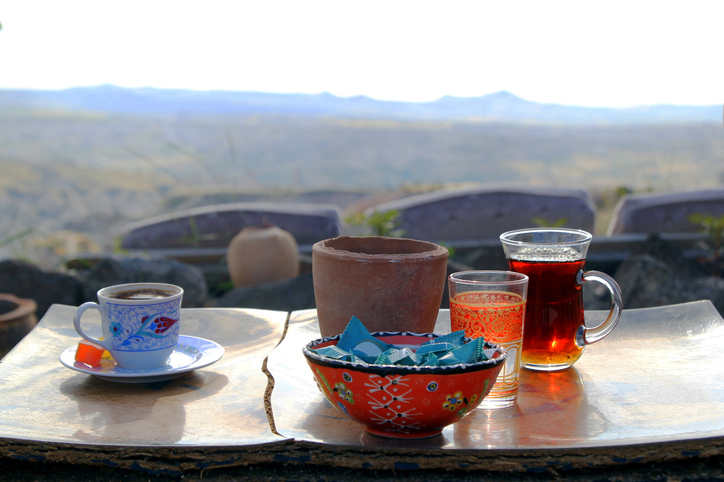 Travel to Cappadocia, Turkey. The cup of turkish tea and coffee on the wooden table in the mountains.