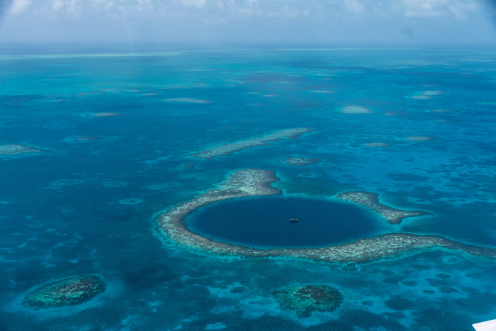An areal view of the coral reef phenomenon of the Blue Hole off the coast of Belize