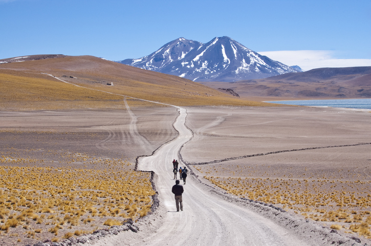 Tourists walking in chilean high plateau
