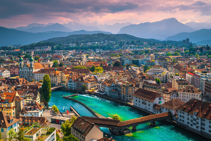 Picturesque panorama of Lucerne from the fortress tower with famous Chapel bridge on the Reuss river at sunset, Luzern, Switzerland, Europe