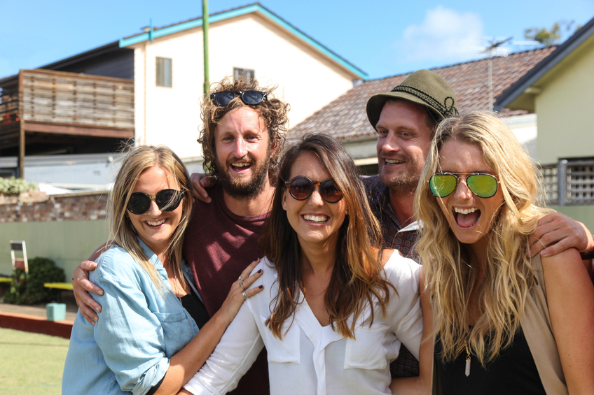 A group of friends having fun together at bowls at Bondi Australia.