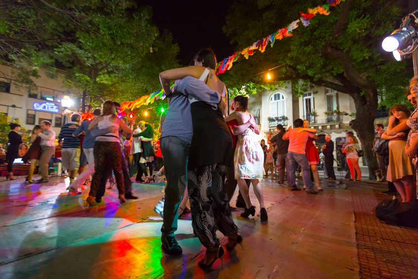 Buenos Aires, Argentina  - November 17, 2014: Group of people dancing the tango at night on the main square of San Telmo in Buenos Aires, Argentina 2014