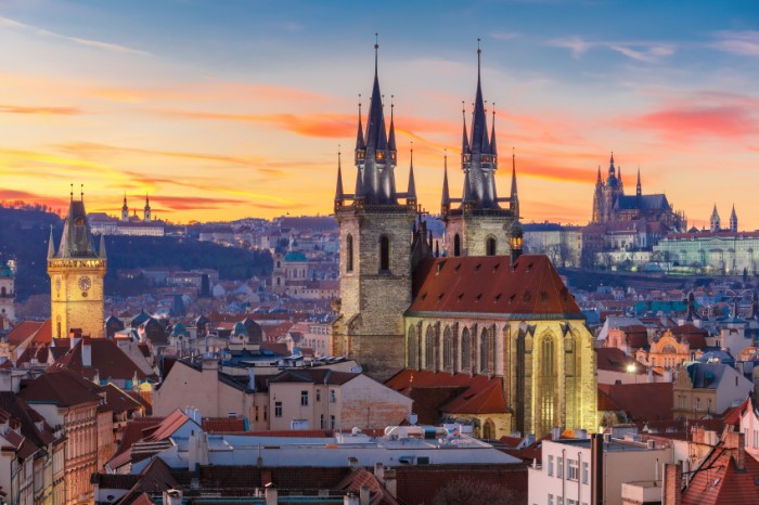 Aerial view over Church of Our Lady before Tyn, Old Town and Prague Castle at sunset in Prague, Czech Republic