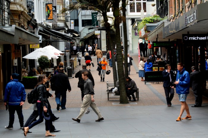 Auckland, New Zealand - October 13, 2015: Padestrians walk down Vulcan Lane in Auckland downtown, New Zealand. It's a popular cobblestone plaza off Queen St home to fashionable restaurants, cafes, pubs and stores.