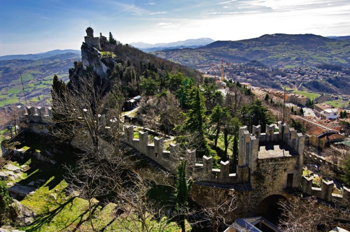 One of the three towers. The Republic of San Marino is a country in the Apennines. It is a landlocked enclave, completely surrounded by Italy. The Three Towers of San Marino are a group of towers located on the three peaks of Monte Titano in the capital, also called San Marino.
