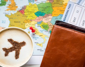 Europe map and airplane in cappuccino (made of cinnamon). Travel concept. Travel agency