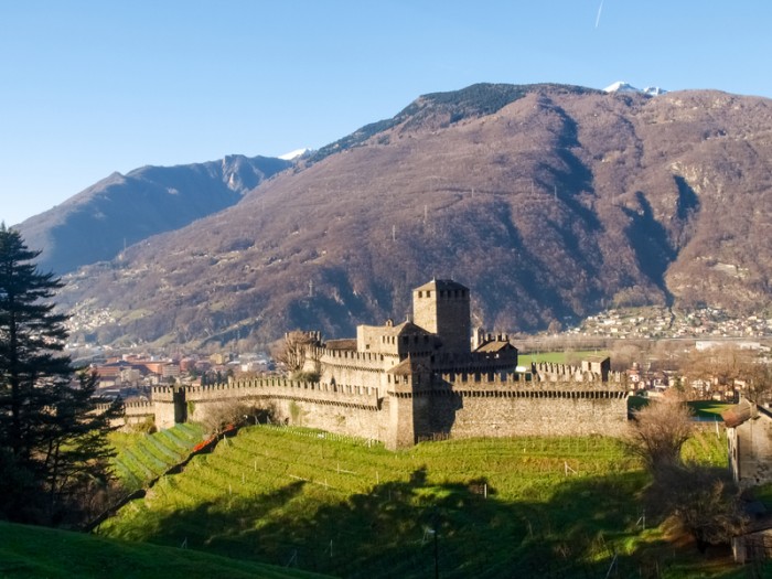 Bellinzona, Switzerland - december 20, 2014: along the pedestrian path of the castles of Castelgrande, Montebello, Sasso Corbaro with afternoon/evening light and blue sky.