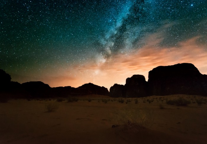 Milky way above red Wadi Rum desert in Jordan.
