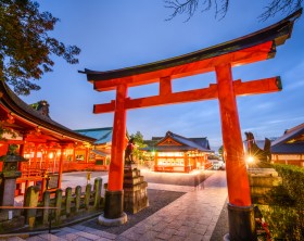 Kyoto, Japan- November 23, 2015: Motion blur of visitors at Fushimi Inari Taisha Shrine. The shrine is noted for its numerous torii gates.