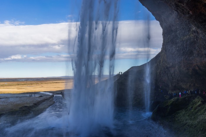 Seljalandsfoss waterfall in southern iceland. A passage behind the water is accessible to tourists