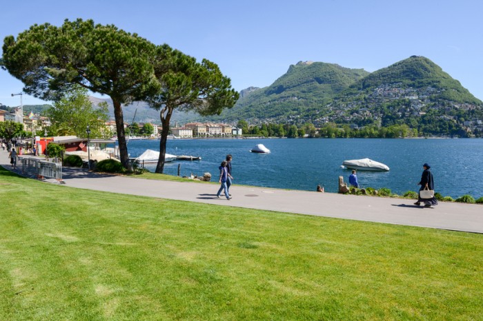 Lugano, Switzerland - 5 may 2016:  People walking on the lakeside of Lugano on the italian part of Switzerland