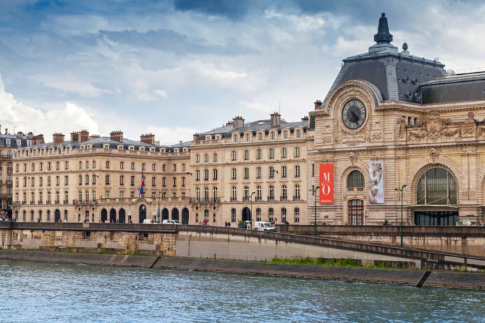 Paris, France - August 7, 2014: Seine river view, facade of the Orsay modern art Museum