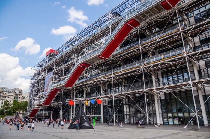 Paris, France - August 08, 2014: Centre Pompidou with unidentified people. The modern museum building is designed in style of hightech architecture by architects Richard Rogers, Renzo Piano and Gianfranco Franchini.