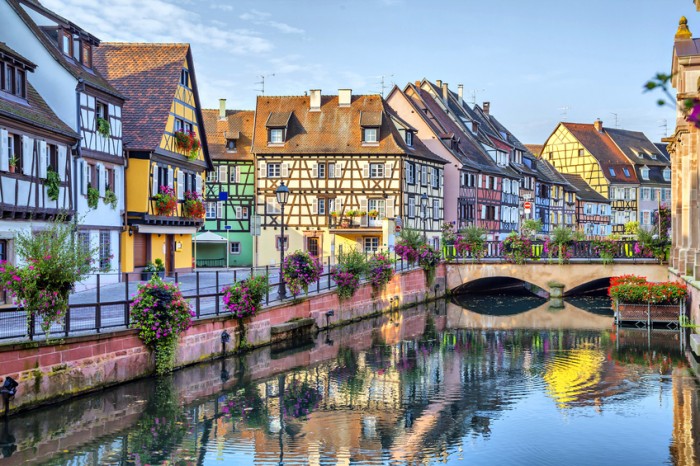 Colorful traditional french houses on the side of river Lauch in Petite Venise, Colmar, France