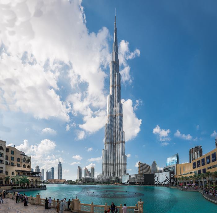 Dubai, United Arab Emirates - December 2, 2014 : View of the Burj Khalifa, the tallest building in the world. View looking to tourists by the Dubai Mall fountain.