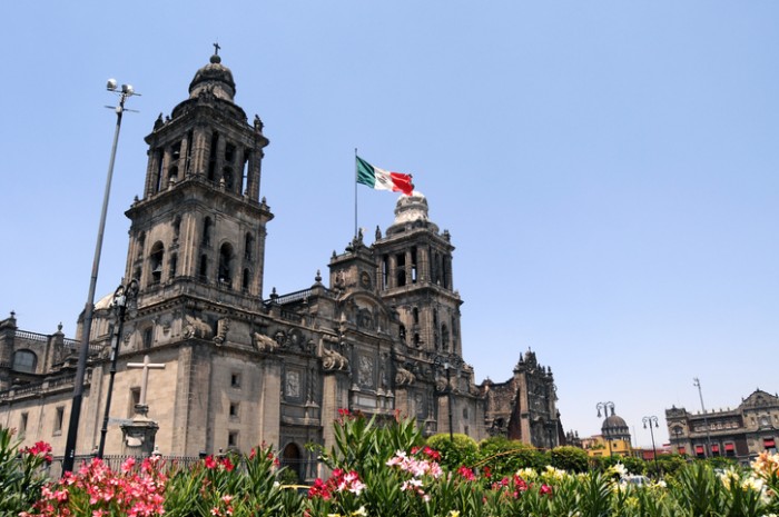 Mexico City Metropolitan Cathedral (Catedral Metropolitana de la Asunción de María) is the largest and oldest cathedral in the Americas, built in 1573-1813, and seat of the Roman Catholic Archdiocese of Mexico, seen here with flowers planted on the Zocalo Square.