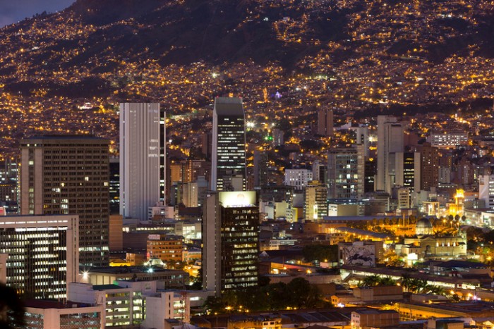 Medellin, Colombia - March 11, 2015: Aerial view of Medellin at night with residential and office buildings.