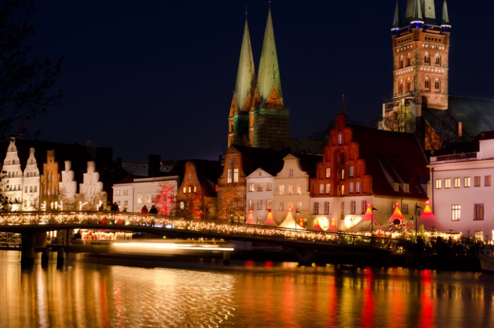 Luebeck, Christmas mood at the obertrave with churches st.marien and petri Tower