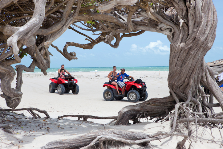 Jericoacoara, Brazil - November 19, 2011: People in ATV cars during an excursion in national park of Jericoacoara, Ceara, Brazil