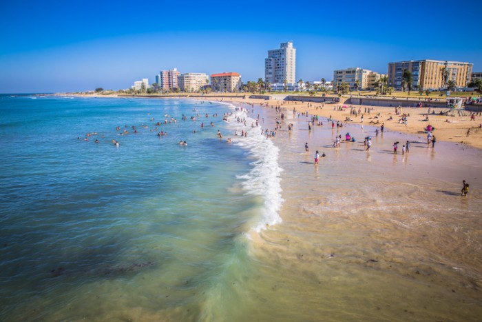 Port Elizabeth, South Africa - January 25, 2015: Port Elizabeth, South Africa - 18 JANUARY 2015, Look at the people on the beach enjoyng the sund at waterfront of Port Elizabeth