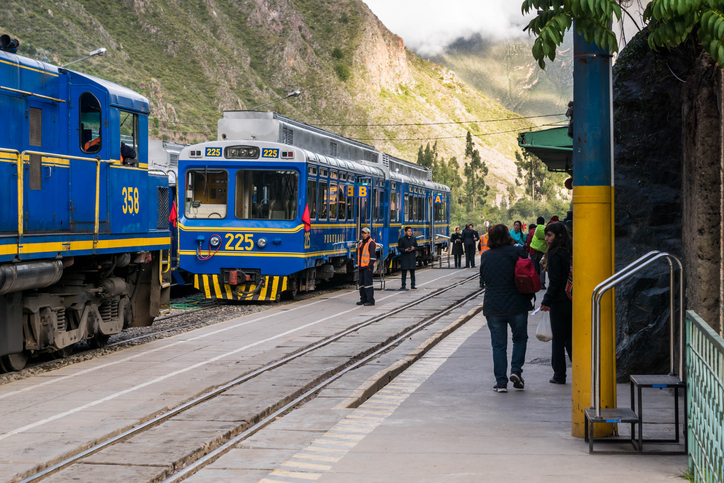 Ollantaytambo, Peru - February 4, 2015: Perurail trains are about to take passengers to Machu Picchu Pueblo (formerly Aguas Calientes). This is a cheaper route to get to the Inca's complex than directly from Cusco. Plus, even though it is cheaper, you get to see Ollantaytambo village where a lot of Inca ruins are on the mountains nearby.