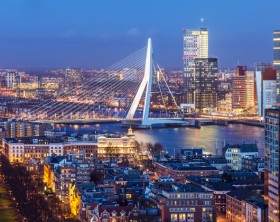 Aerial shot of Rotterdam skyline with Erasmus bridge at twilight as seen from the Euromast tower, The Netherlands