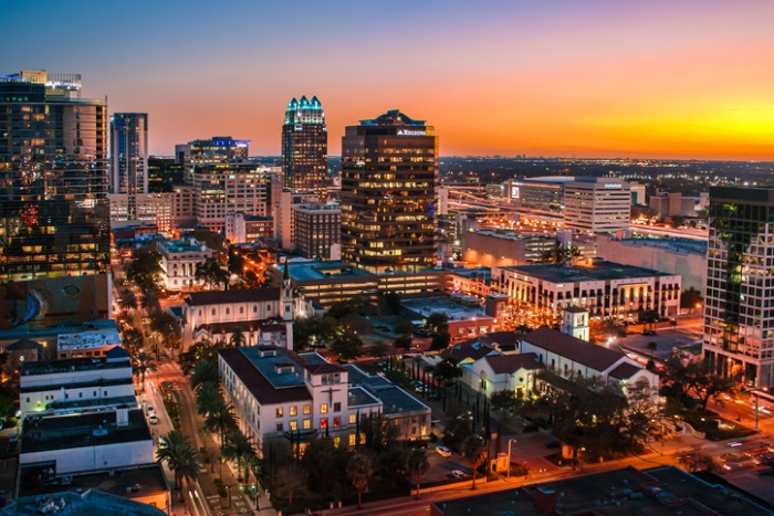 This is a beautiful photo capturing the Downtown Orlando Skyline at sunset.