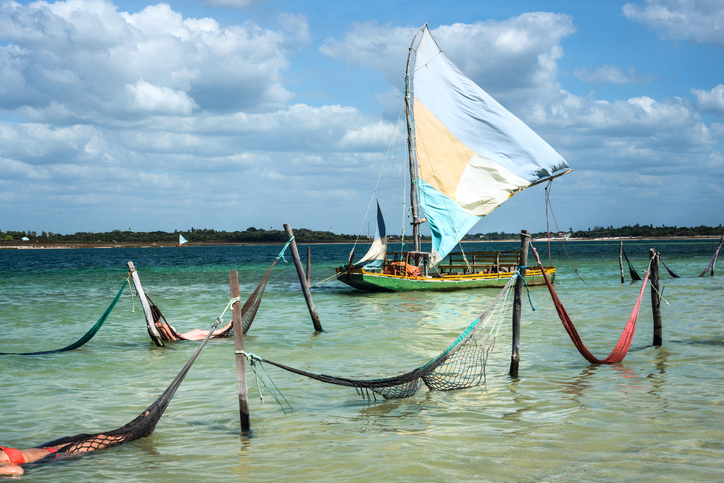 Sail boat and hammocks at the Paradise Lake (Jericoacoara, Brazil)