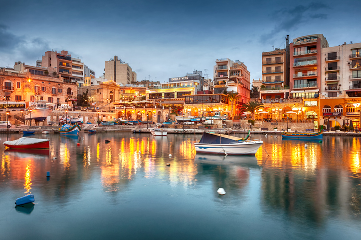 Portomaso, Malta - January 19, 2015: Spinola Bay with boats in front of famous touristic restaurants at St Julian, Malta