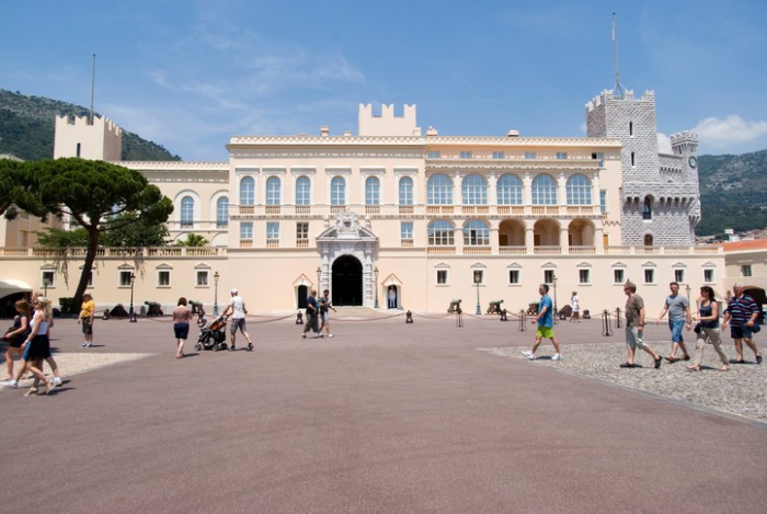 Monaco-Ville, Principality of Monaco – June 12, 2014: View of Prince's Palace - is official residence the prince of Monaco. Tourists in front.