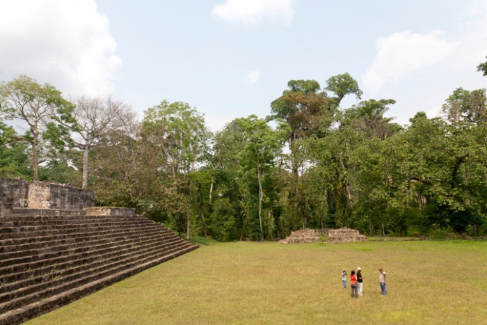 Izabal, Guatemala - April 22, 2011: Tourists listen to the guide at Quirigua national park in Guatemala.