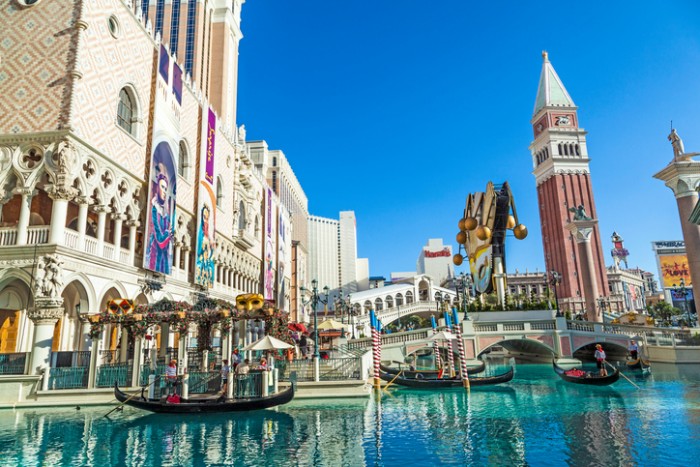 Las Vegas, USA - June 15, 2012: people enjoy the Venetian Resort Hotel & Casino. The resort opened on May 3, 1999 with flutter of white doves, sounding trumpets, singing gondoliers and actress Sophia Loren.