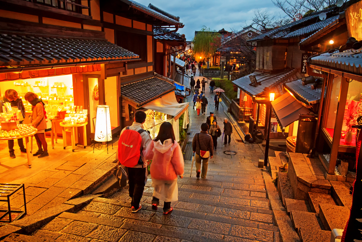 KYOTO, JAPAN - November 25 2013: Tourists walk on a street leading to Kiyomizu Temple on November 25 2013 for Sakura viewing. Kiyomizu is a famous temple in Kyoto built in year 778