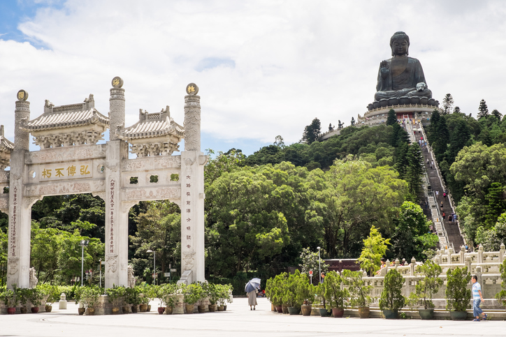 Hong Kong, China - August 26, 2014: Tian Tan Buddha, also known as the Big Buddha, is a large bronze statue, completed in 1993, on Lantau Island.