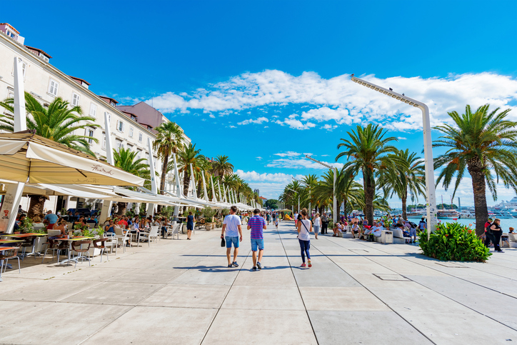 Split, Croatia - September 17, 2016: Seafront promenade area in Split old town with restaurants and cafes on a sunny day
