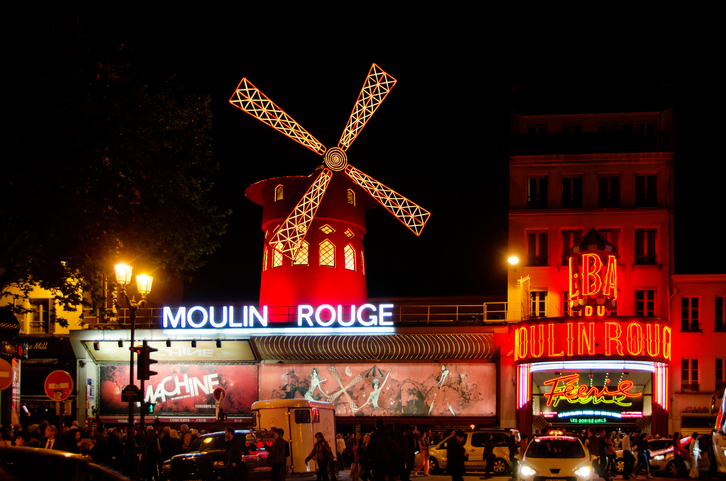 Paris, France - April 30: The Moulin Rouge by night, on April 30, 2014 in Paris, France. Moulin Rouge is a famous cabaret built in 1889, locating in the Paris red-light district of Pigalle