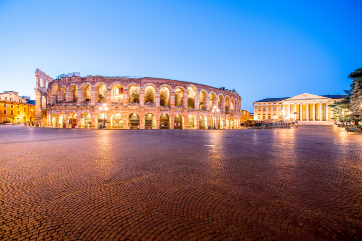 Night view on illuminated Arena on Bra square in Verona city