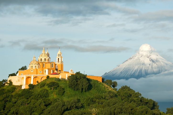 View of Popocatepetl volcano, with the church of Nuestra Se?ora de los Remedios at the front. City of Cholula, Mexico.
