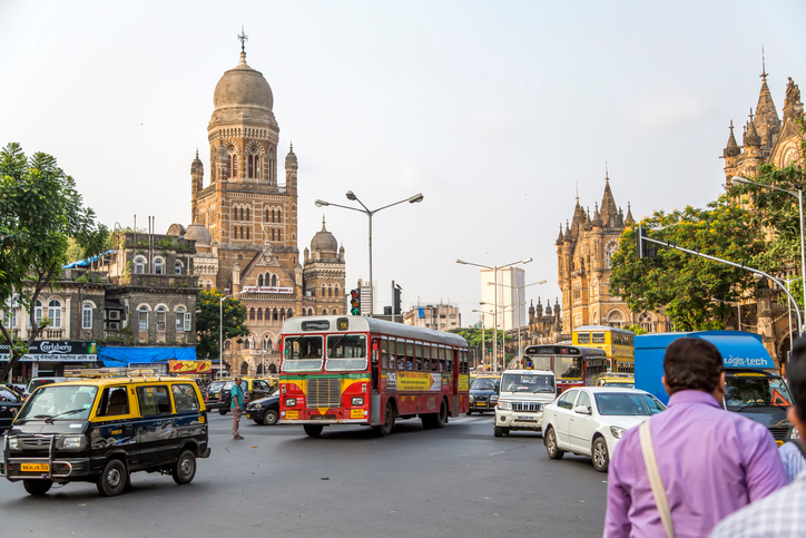 Mumbai, India - October 9, 2015: Unidentified people by the Municipal Corporation Building in Mumbai, India. This gothic building was completed at 1893 and since 2005 is a Grade IIA heritage building.