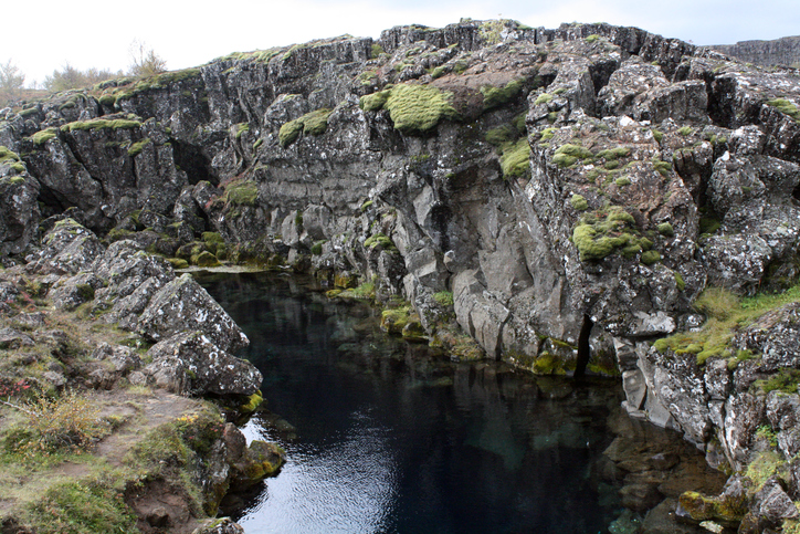 Mossy volcanic landscapes at Thingvellir National Park in Iceland. Just outside Reykjavik, it is full of untouched rock formations, rivers and waterfalls.